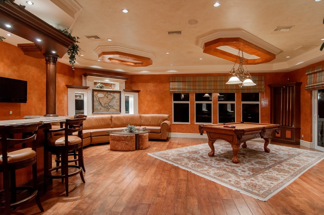 game room with wood floors