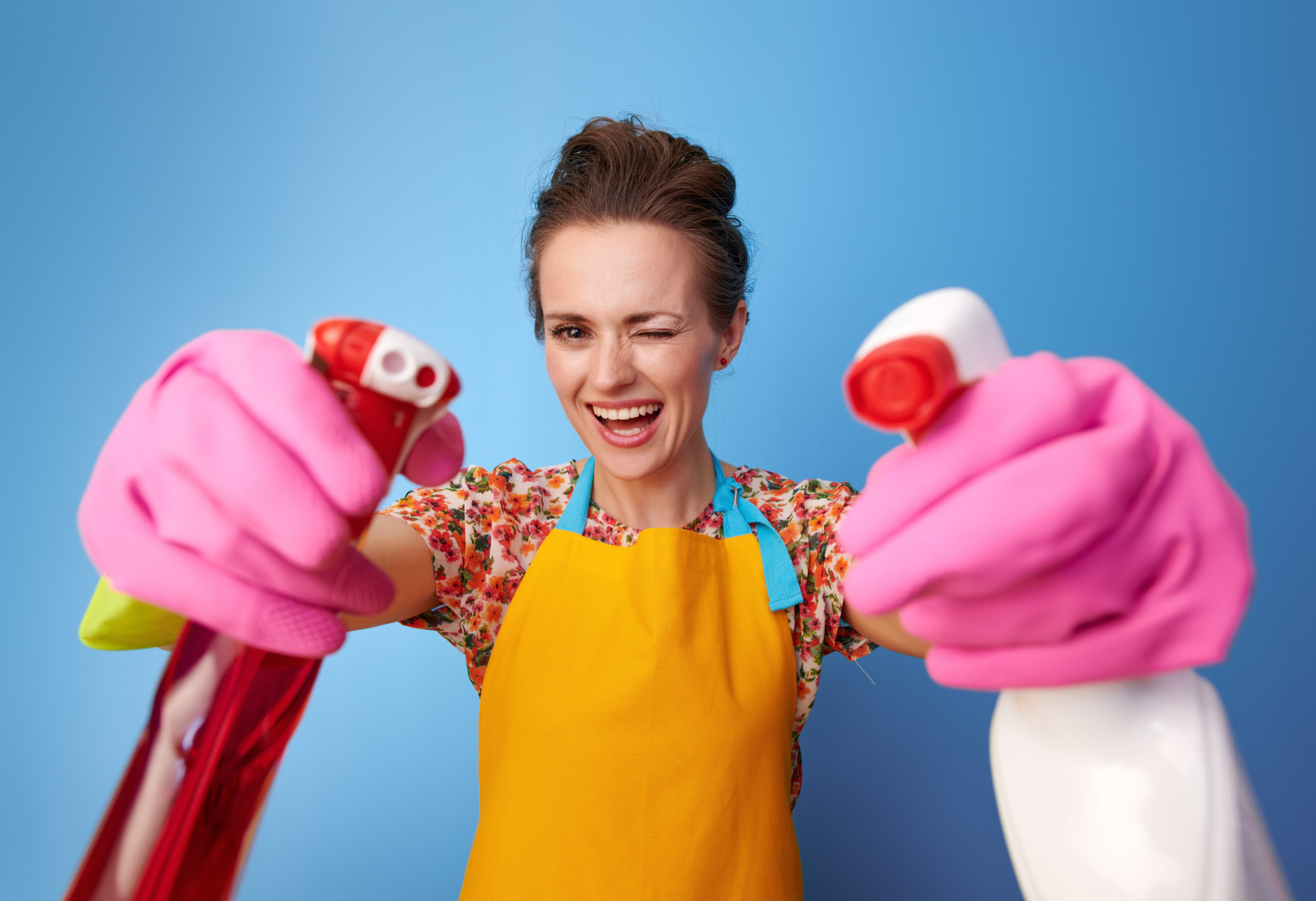 woman with household cleaning supplies