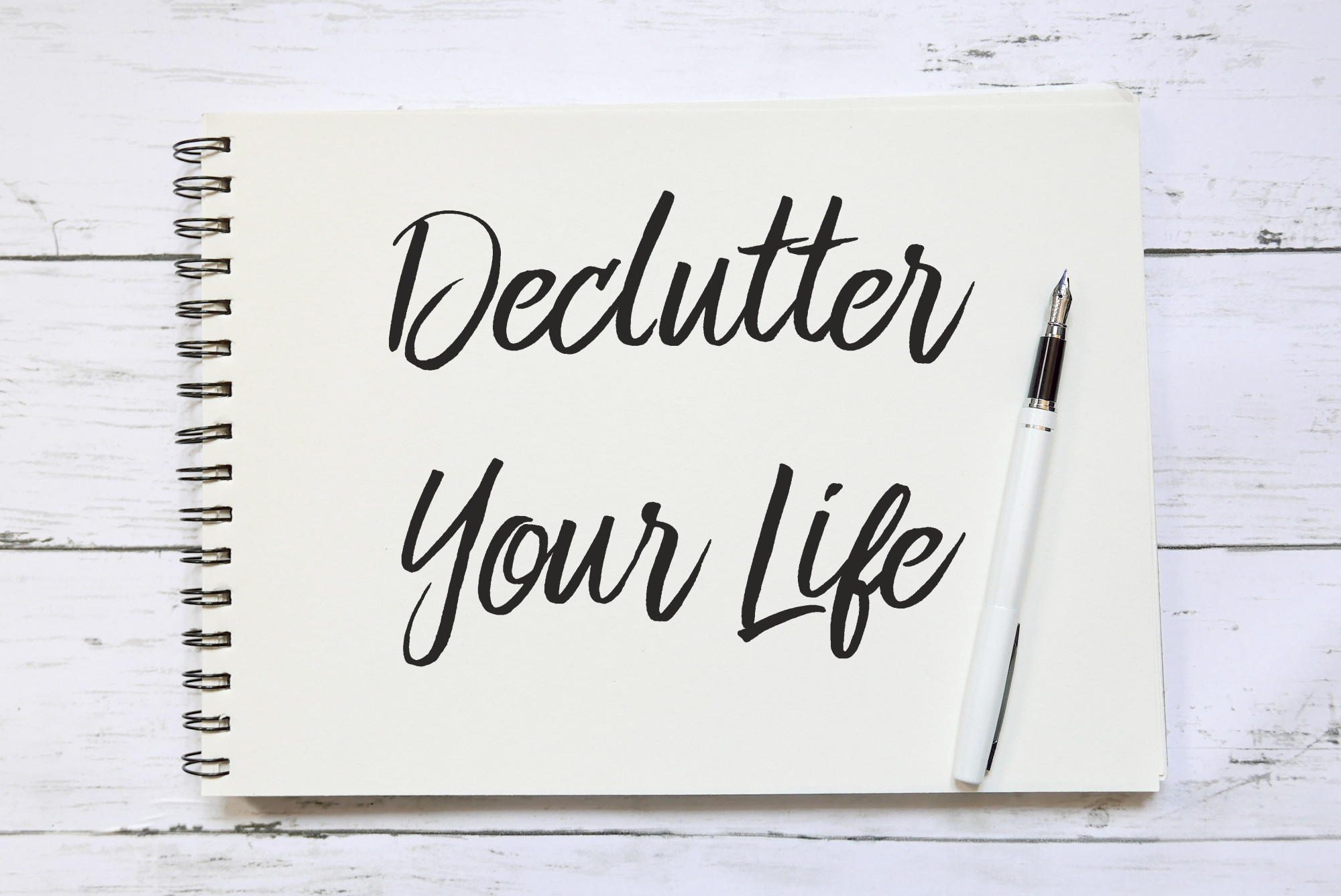 declutter your life written on notebook